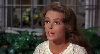Movie still from “Guess Who's Coming to Dinner” (1967), directed by Stanley Kramer – A person wearing a dress; Close Up shot, Over the shoulder angle