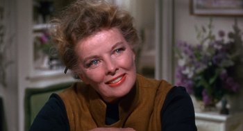 Movie still from “Guess Who's Coming to Dinner” (1967), directed by Stanley Kramer – An older woman is smiling for the camera; Close Up shot, Over the shoulder angle