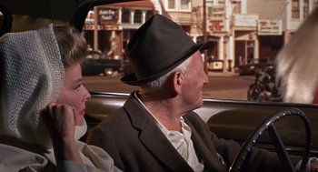 Movie still from “Guess Who's Coming to Dinner” (1967), directed by Stanley Kramer – An older man and a woman in a car; Medium shot, Over the shoulder angle