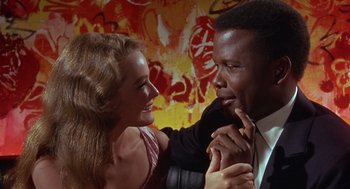 Movie still from “Guess Who's Coming to Dinner” (1967), directed by Stanley Kramer – A man and a woman are smiling at each other; Close Up shot, Low angle