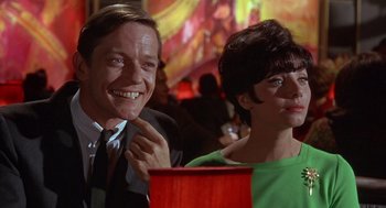 Movie still from “Guess Who's Coming to Dinner” (1967), directed by Stanley Kramer – A man and a woman smiling for the camera; Close Up shot, Low angle