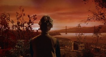 Movie still from “Guess Who's Coming to Dinner” (1967), directed by Stanley Kramer – A woman looking out over a bay at sunset; Wide shot, Low angle