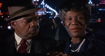 Movie still from “Guess Who's Coming to Dinner” (1967), directed by Stanley Kramer – A man and a woman sitting next to each other; Close Up shot, Over the shoulder angle