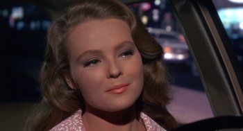 Movie still from “Guess Who's Coming to Dinner” (1967), directed by Stanley Kramer – A woman's face in front of a car; Close Up shot, Over the shoulder angle
