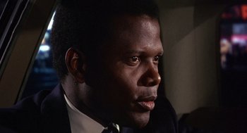 Movie still from “Guess Who's Coming to Dinner” (1967), directed by Stanley Kramer – A person wearing a suit and tie; Close Up shot, Low angle