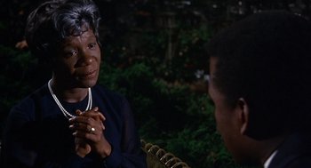 Movie still from “Guess Who's Coming to Dinner” (1967), directed by Stanley Kramer – An older black woman talking to a younger black man; Close Up shot, Over the shoulder angle
