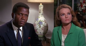 Movie still from “Guess Who's Coming to Dinner” (1967), directed by Stanley Kramer – A man and a woman sitting next to each other in a room; Close Up shot, Low angle