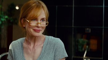 Movie still from “Trespass” (2011), directed by Joel Schumacher – A person wearing glasses; Close Up shot, Over the shoulder angle