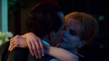 Movie still from “Trespass” (2011), directed by Joel Schumacher – A man and a woman embracing each other; Close Up shot, Over the shoulder angle