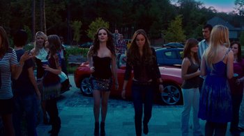 Movie still from “Trespass” (2011), directed by Joel Schumacher – Two young women walking down the street at night; Wide shot, Low angle