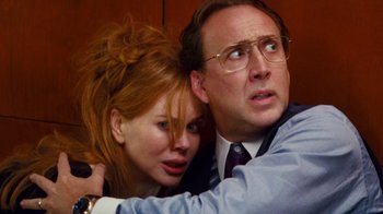 Movie still from “Trespass” (2011), directed by Joel Schumacher – A man and a woman looking at the camera; Close Up shot, Low angle