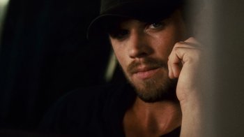 Movie still from “Trespass” (2011), directed by Joel Schumacher – A person wearing a hat; Close Up shot, Over the shoulder angle