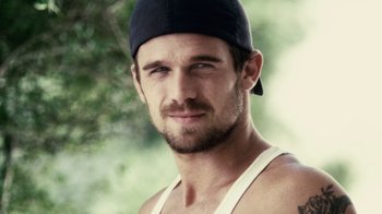 Movie still from “Trespass” (2011), directed by Joel Schumacher – A person wearing a hat; Close Up shot, Over the shoulder angle