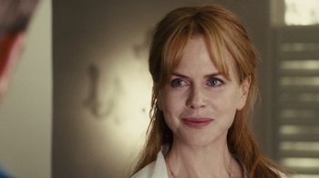 Movie still from “Trespass” (2011), directed by Joel Schumacher – A person with long red hair; Close Up shot, Over the shoulder angle