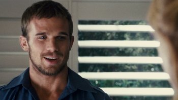 Movie still from “Trespass” (2011), directed by Joel Schumacher – A person wearing a blue shirt; Close Up shot, Over the shoulder angle