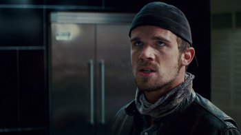 Movie still from “Trespass” (2011), directed by Joel Schumacher – A person wearing a hat and a jacket; Close Up shot, Low angle