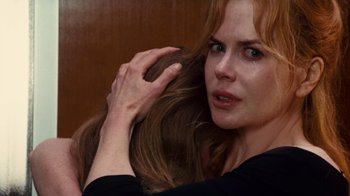 Movie still from “Trespass” (2011), directed by Joel Schumacher – A person combing their hair; Close Up shot, Over the shoulder angle