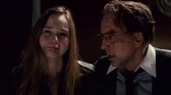 Movie still from “Trespass” (2011), directed by Joel Schumacher – A man and a woman sitting next to each other; Close Up shot, Over the shoulder angle