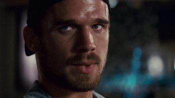 Movie still from “Trespass” (2011), directed by Joel Schumacher – A man's face with a beard; Close Up shot, Over the shoulder angle