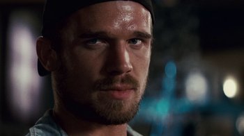 Movie still from “Trespass” (2011), directed by Joel Schumacher – A person wearing a hat; Close Up shot, Low angle