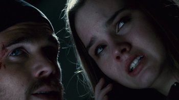 Movie still from “Trespass” (2011), directed by Joel Schumacher – A man and a woman looking at the camera; Close Up shot, Low angle