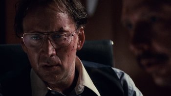 Movie still from “Trespass” (2011), directed by Joel Schumacher – A person wearing glasses with blood on his face; Close Up shot, Low angle