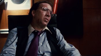 Movie still from “Trespass” (2011), directed by Joel Schumacher – A person wearing glasses and a tie; Close Up shot, Low angle