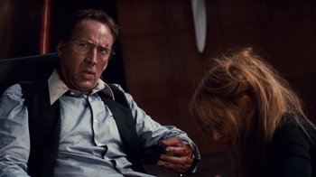Movie still from “Trespass” (2011), directed by Joel Schumacher – A man and a woman sitting on a couch; Close Up shot, Over the shoulder angle