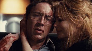 Movie still from “Trespass” (2011), directed by Joel Schumacher – A man and a woman are looking at each other; Close Up shot, Low angle