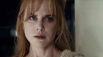 Movie still from “Trespass” (2011), directed by Joel Schumacher – A person with long blonde hair; Close Up shot, Over the shoulder angle