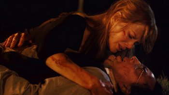 Movie still from “Trespass” (2011), directed by Joel Schumacher – A man and a woman laying on a bed; Close Up shot, Low angle