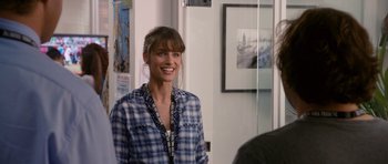 Movie still from “Gulliver's Travels” (2010), directed by Rob Letterman – A woman smiling for the camera in front of a mirror; Close Up shot, Over the shoulder angle