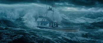 Movie still from “Gulliver's Travels” (2010), directed by Rob Letterman – A boat in the middle of a large wave in the ocean; Extreme Wide shot, Low angle