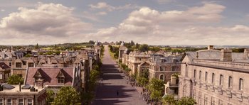 Movie still from “Gulliver's Travels” (2010), directed by Rob Letterman – An aerial view of a city street with a lot of buildings; Extreme Wide shot, High angle