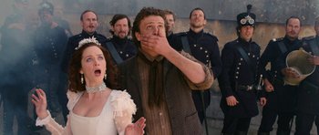 Movie still from “Gulliver's Travels” (2010), directed by Rob Letterman – A group of people standing next to each other; Close Up shot, Low angle