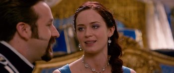 Movie still from “Gulliver's Travels” (2010), directed by Rob Letterman – A person wearing a necklace and earrings; Close Up shot, Over the shoulder angle