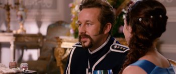 Movie still from “Gulliver's Travels” (2010), directed by Rob Letterman – A man in a military uniform looking to his left; Close Up shot, Over the shoulder angle