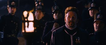 Movie still from “Gulliver's Travels” (2010), directed by Rob Letterman – A group of men standing next to each other; Close Up shot, Over the shoulder angle