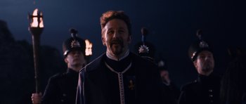 Movie still from “Gulliver's Travels” (2010), directed by Rob Letterman – A man with a beard wearing a military uniform; Close Up shot, Low angle