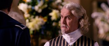 Movie still from “Gulliver's Travels” (2010), directed by Rob Letterman – An old man with a beard and a white mustache; Close Up shot, Over the shoulder angle