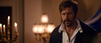 Movie still from “Gulliver's Travels” (2010), directed by Rob Letterman – A person wearing a jacket; Close Up shot, Over the shoulder angle