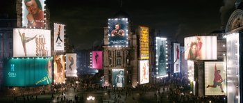 Movie still from “Gulliver's Travels” (2010), directed by Rob Letterman – People are gathered in a city square at night; Extreme Wide shot, Low angle