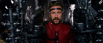 Movie still from “Gulliver's Travels” (2010), directed by Rob Letterman – A man in a red jacket and a black helmet; Medium shot, Low angle