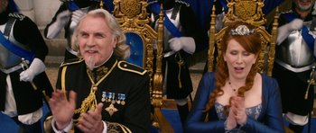 Movie still from “Gulliver's Travels” (2010), directed by Rob Letterman – A man and a woman sitting on a throne; Medium shot, Over the shoulder angle