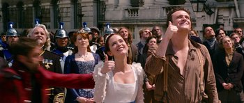 Movie still from “Gulliver's Travels” (2010), directed by Rob Letterman – A group of people standing in front of a building; Medium shot, Low angle