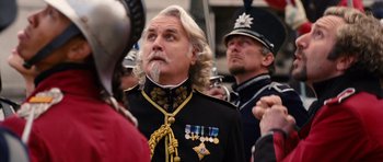 Movie still from “Gulliver's Travels” (2010), directed by Rob Letterman – A man with long white hair wearing a military uniform; Close Up shot, Low angle