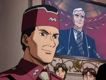 Movie still from “Gundam Wing: The Movie - Endless Waltz” (1998), directed by Yasunao Aoki – A man with a hat is in front of a picture of a man; Close Up shot, Low angle