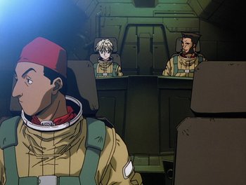 Movie still from “Gundam Wing: The Movie - Endless Waltz” (1998), directed by Yasunao Aoki – A group of people sitting in a vehicle; Medium shot, Low angle