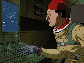 Movie still from “Gundam Wing: The Movie - Endless Waltz” (1998), directed by Yasunao Aoki – An animation of a man using a computer keyboard; Medium shot, Low angle
