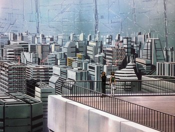 Movie still from “Gundam Wing: The Movie - Endless Waltz” (1998), directed by Yasunao Aoki – Two people standing on the side of a building looking over a city; Extreme Wide shot, High angle
